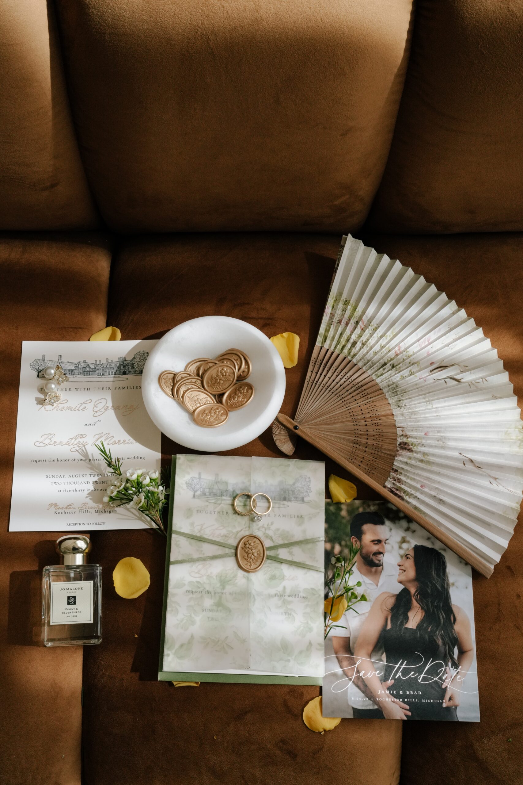 Wedding rings and wedding accessories arranged on a table.